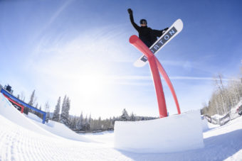 Zoi Sadowski-Synnott grinding a red rail at x games 2021