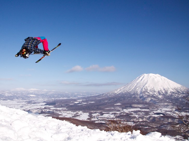 Nicole Lejdeby - Backflip on a bluebird slush day .