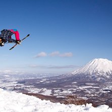 Nicole Lejdeby - Backflip on a bluebird slush day .
