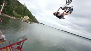 Crazy bike jump into whater